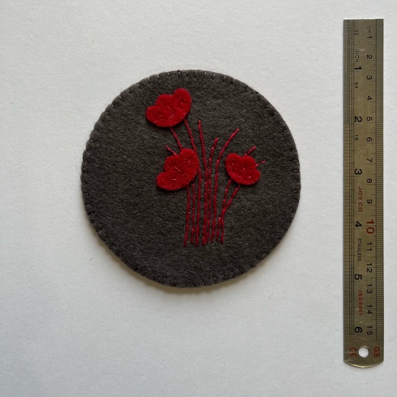 ‏Handcrafted felt coasters and embroidered with silk threads.at of 4 - Picture 4 of 5